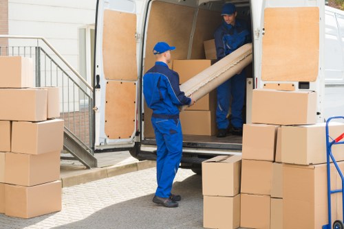 Removal team preparing a safe move with protective equipment