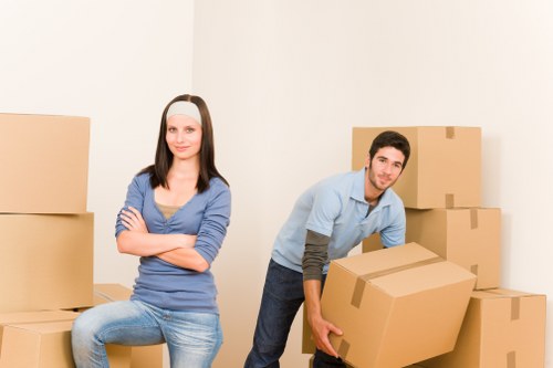 Movers unloading boxes during a fast relocation in Brompton