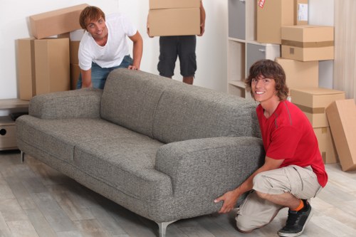 Staff organising labels and equipment for office removals in Brompton