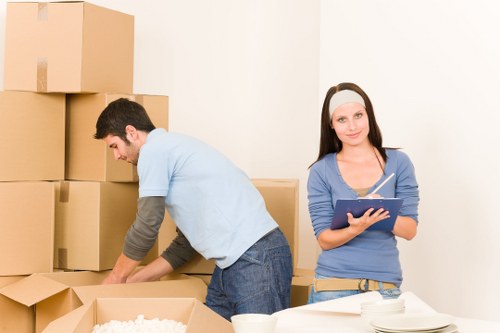 Office relocation items being loaded into a removal van