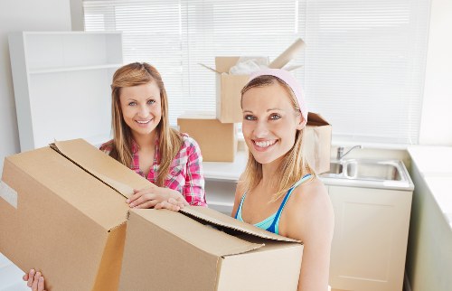 Staff assessing moving risks before lifting